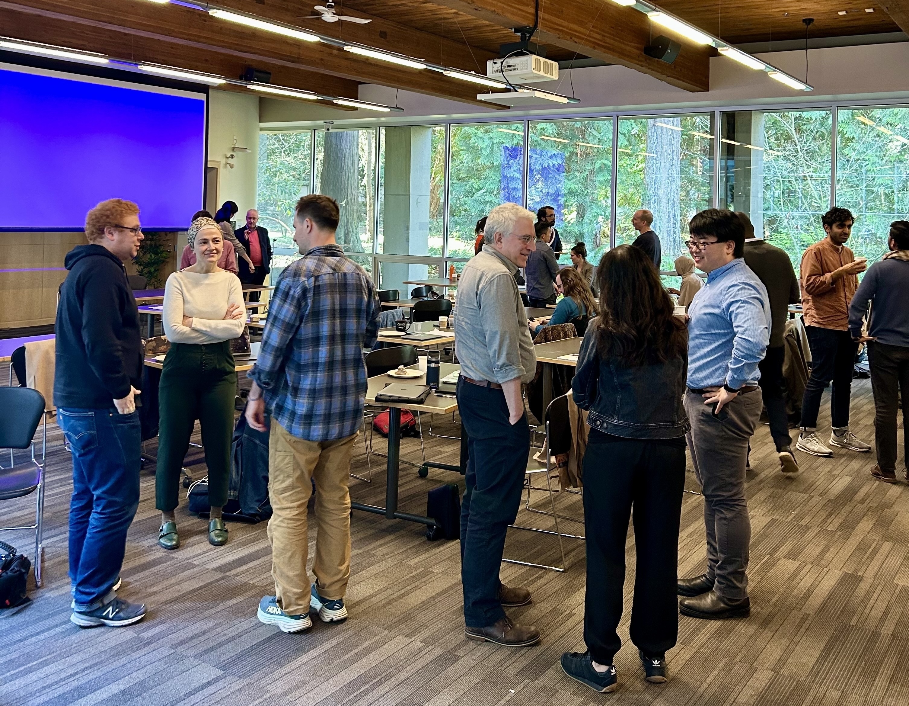 Symposium attendees mingling between papers