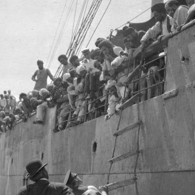 Men on dock looking up at men trapped on the Komagata Maru, July 1914, Vancouver.